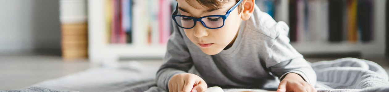 Boy reading on his own