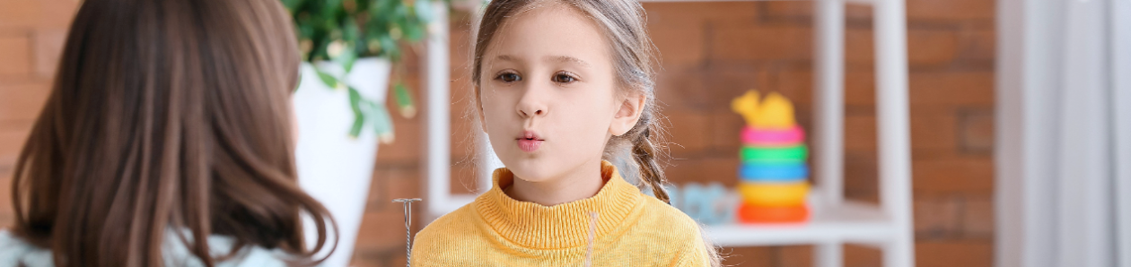 Parent working with her child on their speech