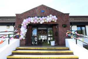 The entrance to the Pavestone Centre with a balloon arch in place
