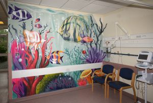 A colourful mural within a hospital setting