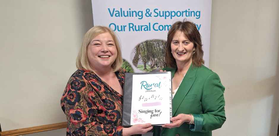 Karen Diamond and Yvonne Carson pictured with a song book