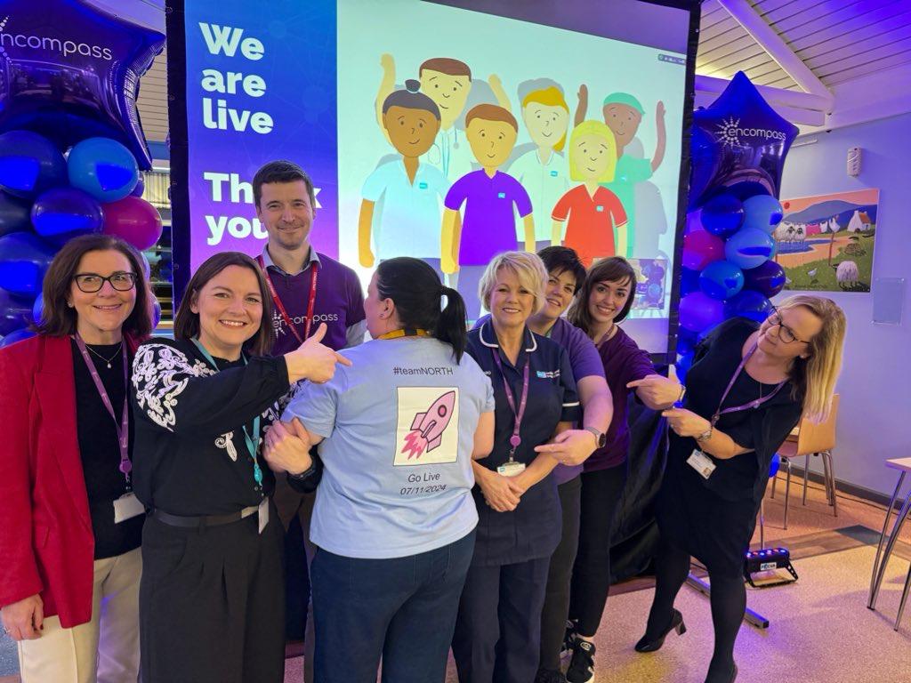 Staff celebrating encompass go live in the Northern Trust