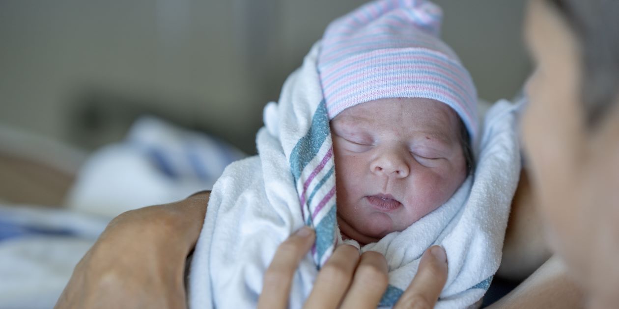 New born baby in mother's arms