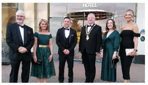 4 males and 2 females dressed in formal attire