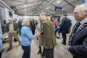 Christina Faulkner from the Farm Families team shakes hands with HRH The Duke of Ediburgh.
