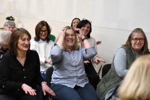 Participants take part in a singing session together.