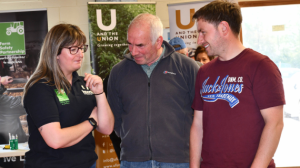 Farmers talk to staff at event