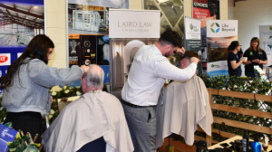 Farmers taking opportunity to get their hair cut.