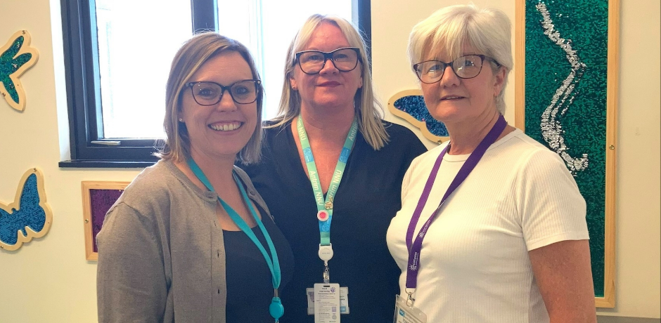 Three staff standing together delighted to be recognised for BLISS award