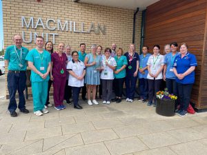 All of the staff members of the Macmillan Team standing outside the Macmillan Unit