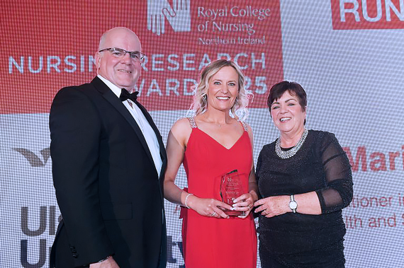Advanced Nurse Practitioner in District Nursing, Maria Betts, who was was runner up in the Nursing Research award, pictured with Owen Barr and Rita Devlin.
