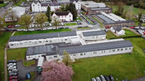 An aerial view of Mid-Ulster Hospital showing solar panels on the roof.