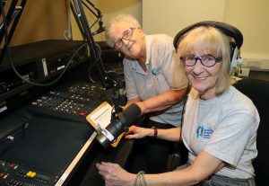 Two women sitting in a radio studio.