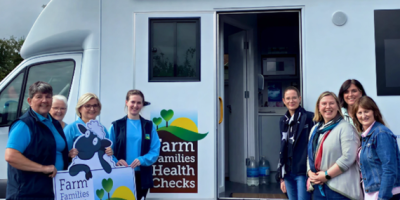 Farm Families Health Check Nurses standing beside Australian visiting Farm Families Nurses outside the Farm Families Health Check van.