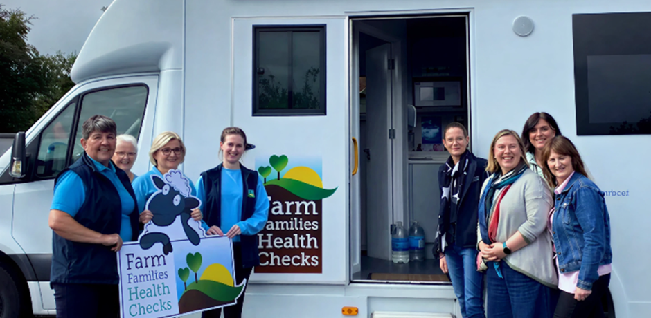 Farm Families Health Check Nurses standing beside Australian visiting Farm Families Nurses outside the Farm Families Health Check van.