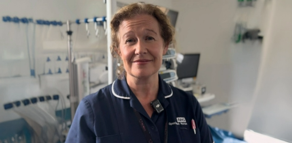 Organ donation specialist nurse Jacqueline Heasley, wearing a navy tunic while standing in a clinical environment.