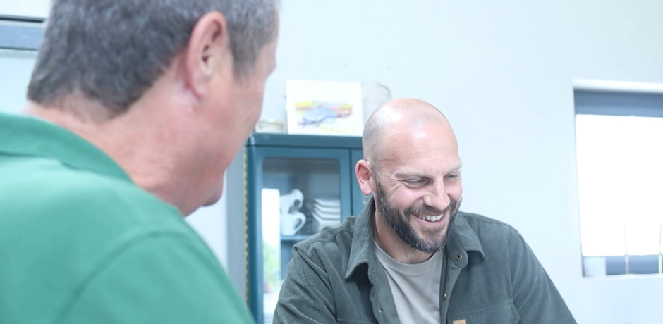 Two men sitting together.