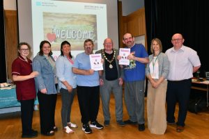 Members of the Northern Trust’s Palliative Care and Learning Disability Working Group with the Mayor of Antrim and Newtownabbey Borough Council, Councillor Neil Kelly.
