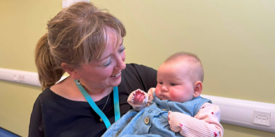 Health visitor Loretta Hegarty at baby massage group with baby Connie