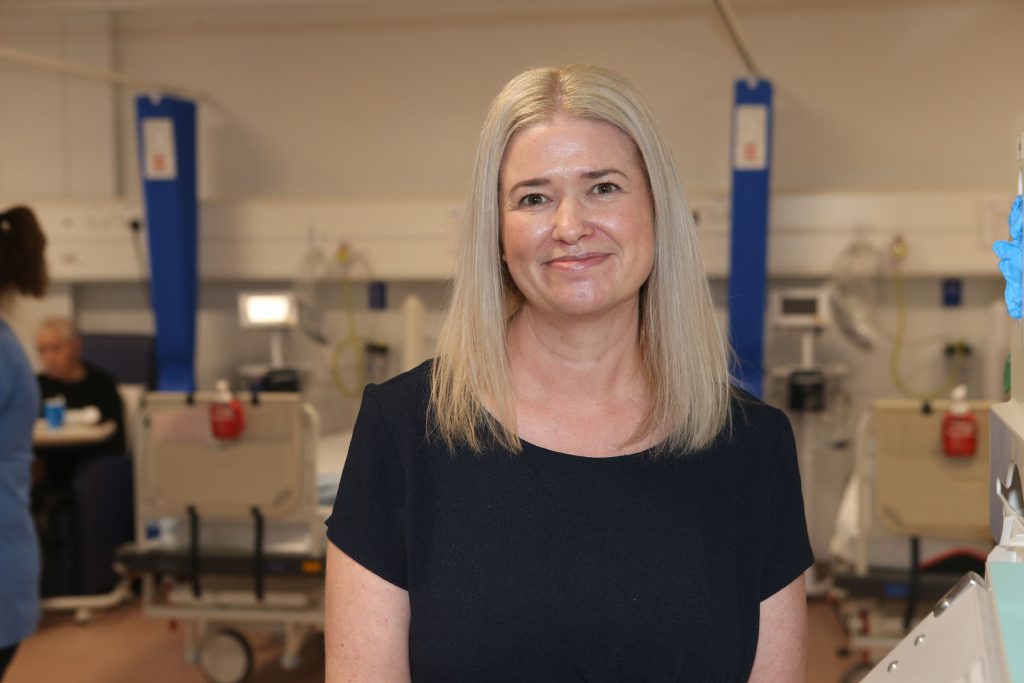 Dr Emily McIntosh standing in a hospital ward
