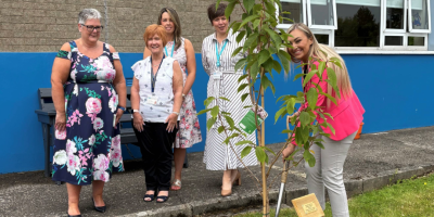 Photogragh of Mayor of Antrim and Newtownabbey Borough Council, Councillor Leah Kirkpatrick and Northern Trust staff planting tree at Inniscoole.