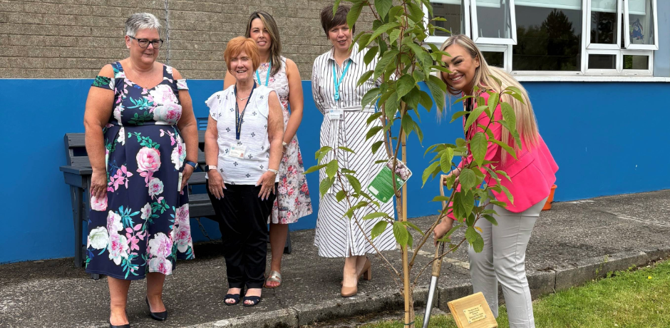 Photogragh of Mayor of Antrim and Newtownabbey Borough Council, Councillor Leah Kirkpatrick and Northern Trust staff planting tree at Inniscoole.