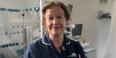 Organ donation specialist nurse Jacqueline Heasley, wearing a navy tunic while standing in a clinical environment.