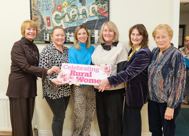 Group of women holding celebrating rural women sign.