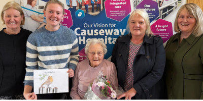 Ethel, winner of the Christmas card competition, with the Chair of the Northern Trust, Anne O'Reilly, and Interim Chief Executive Suzanne Pullins, along with her daughter and granddaughter.