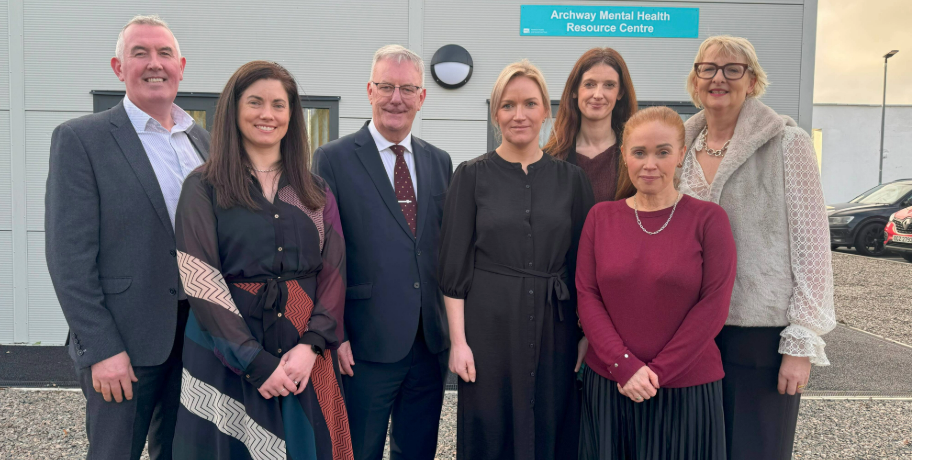 A group of people including the Health Minister standing outside the new Archway building.