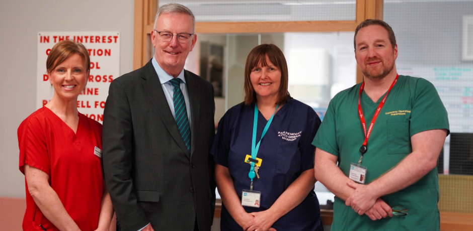 Health Minister Mike Nesbitt stands with three members of staff from Causeway Hospital.