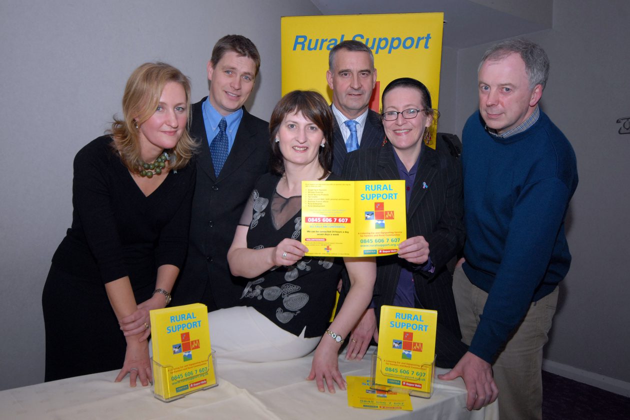 Five people, with leaflets about rural support.