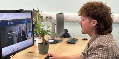 Person sitting at a computer.