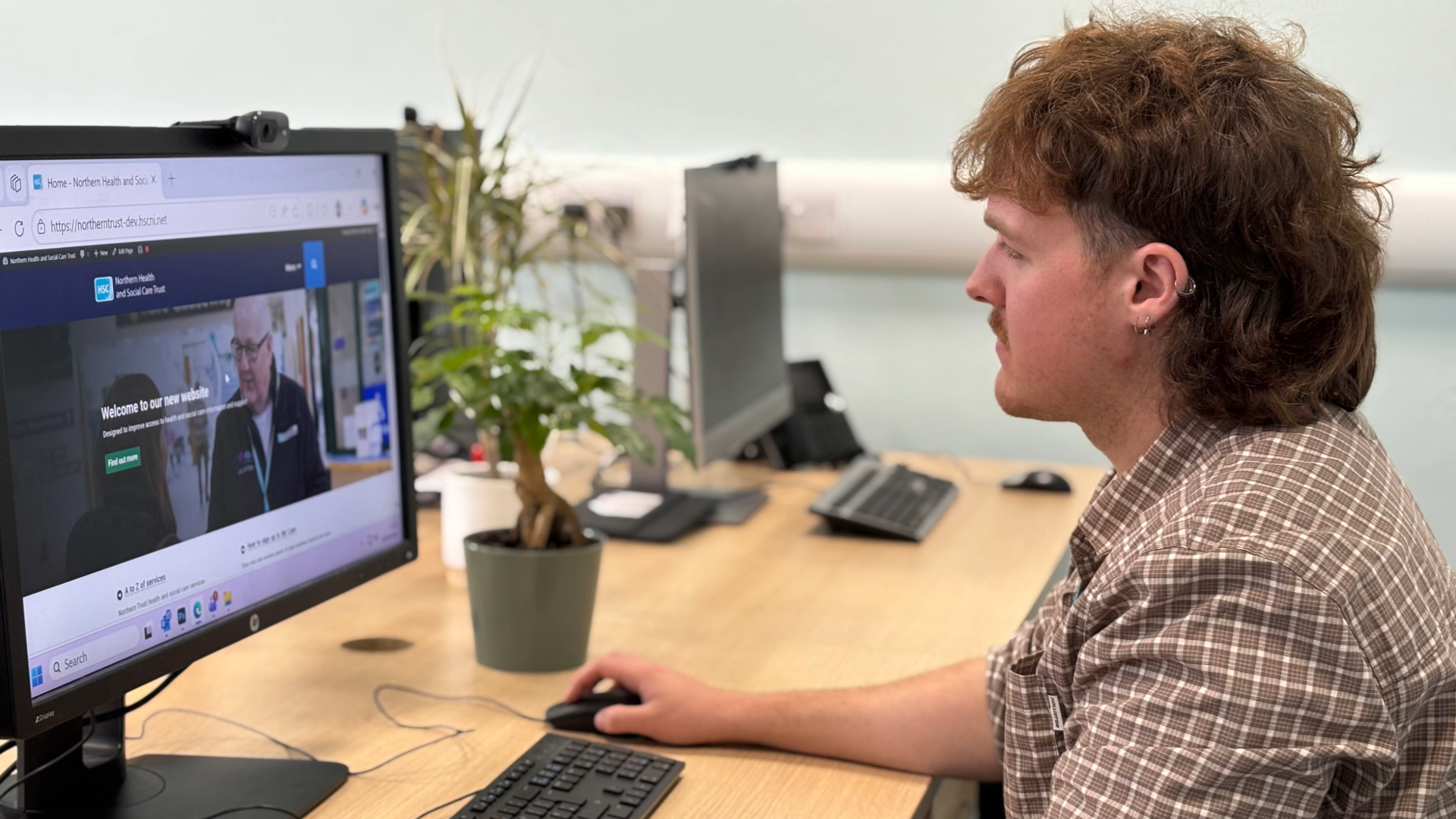 Person sitting at a computer.