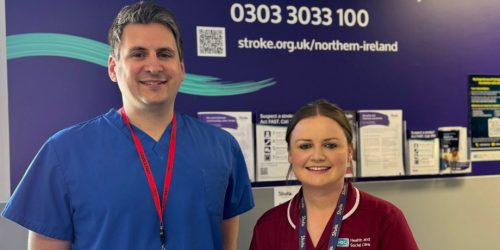 Two healthcare workers standing side-by-side.