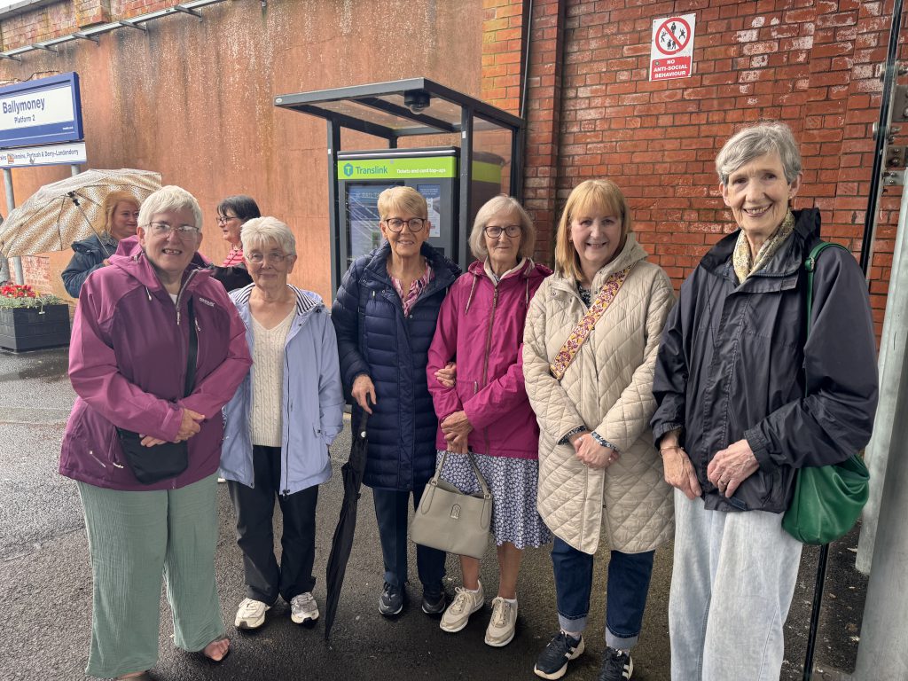 A group of women standing on the platform at Ballymoney station.