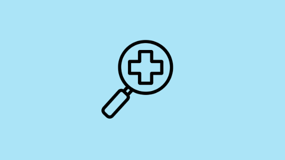 A magnifying glass and medical cross on a blue background.