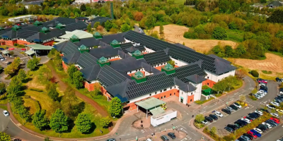A birds-eye view of Causeway Hospital, showing the roof covered in solar panels.