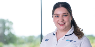 A healthcare worker in a white tunic.