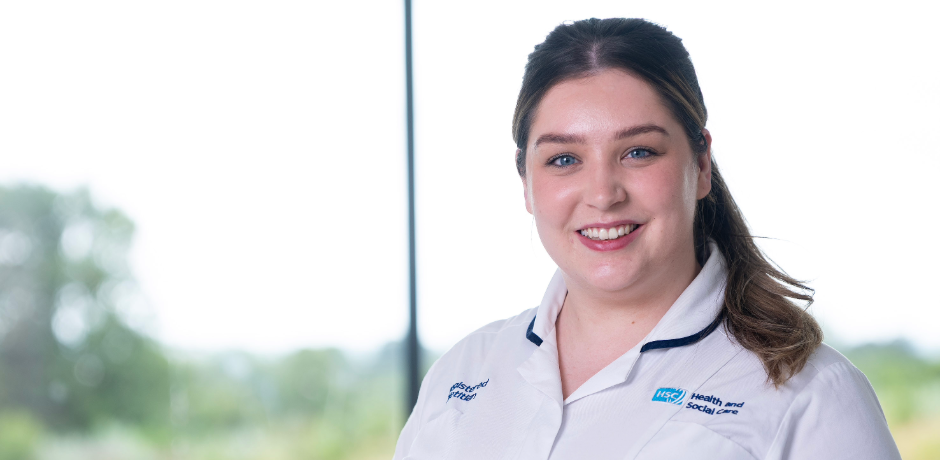 A healthcare worker in a white tunic.
