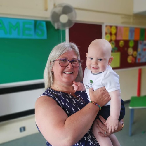 Alberta Lamont who is retiring after leading the Roots of Empathy programme in Cookstown Primary School for the past nine years pictured with baby Matthew Sloan. Alberta Lamont holding baby Matthew Sloan.