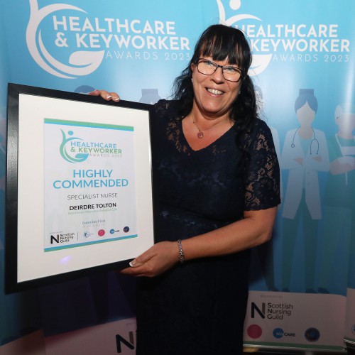 Deirdre Tolton, Highly Commended in the Specialist Nurse category. Deirdre Tolton holding her framed certificate.