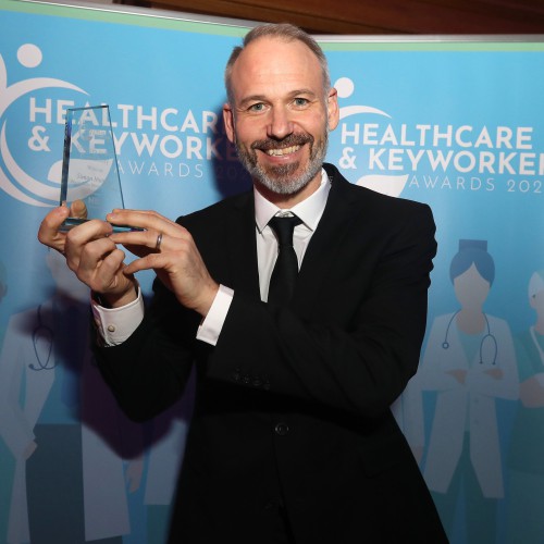 Simon Murphy, winner of the Services in the Community award in recognition of his work as part of the Mentalisation Based Therapy (MBT) treatment team. Simon Murphy holding his award.